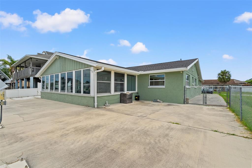 7401 Islander Lane Hudson, FL 34667 - Photo 21 of 30 a view of an house with backyard and porch