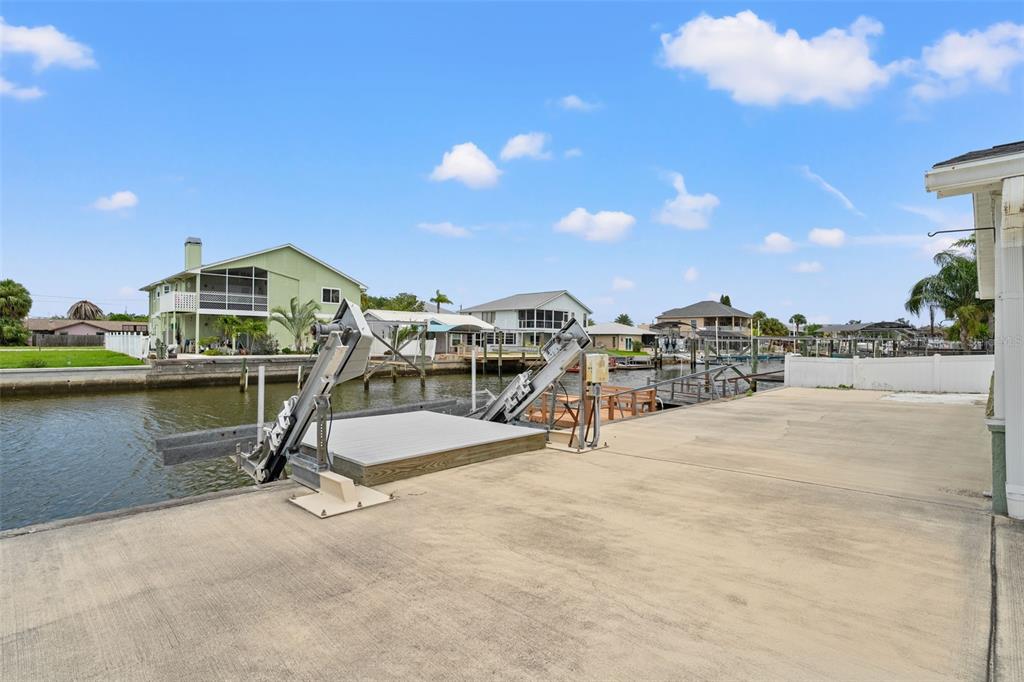 7401 Islander Lane Hudson, FL 34667 - Photo 22 of 30 a view of a lake with a nearby beach