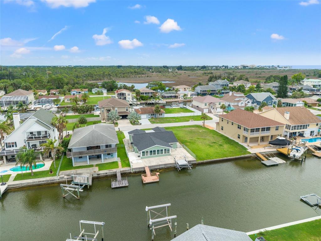 7401 Islander Lane Hudson, FL 34667 - Photo 26 of 30 a view of a lake with houses