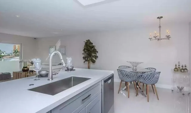 a kitchen with a table and chairs in it