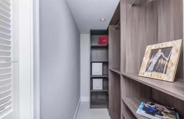 a bedroom with a bed and a lamp