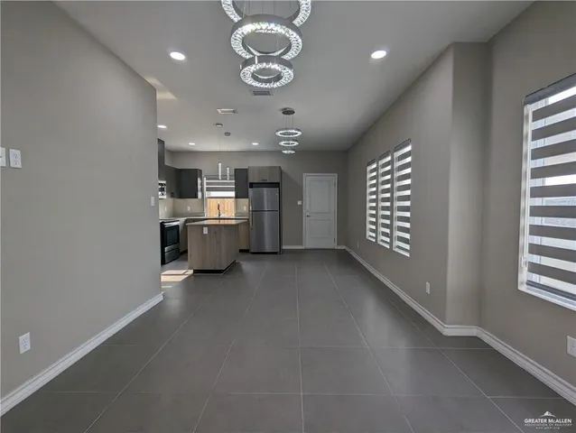 a view of a kitchen with a sink and dishwasher cabinets