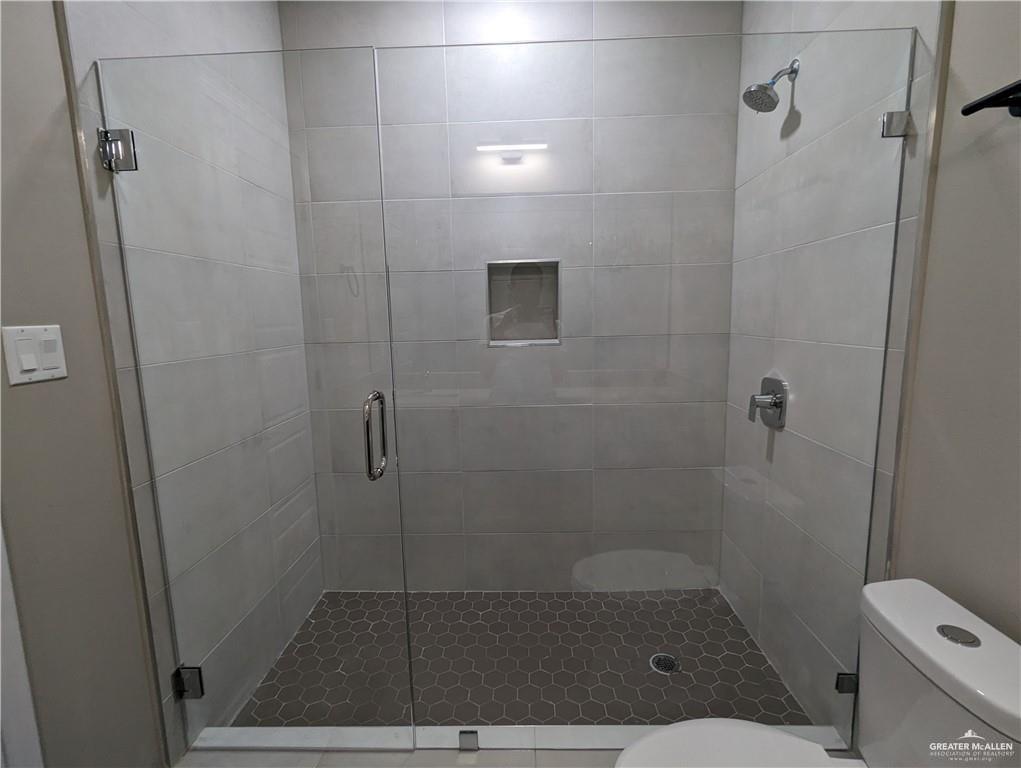 5905 Puffin Avenue, Unit 1 Mission, TX 78573 - Photo 9 of 12 a bathroom with a shower