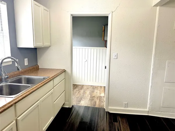 a view of kitchen and wooden floor
