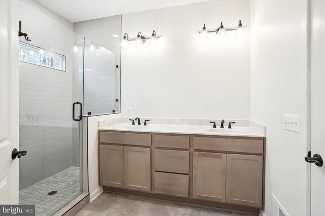 a bathroom with a sink and mirror