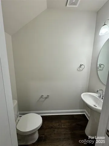 a bathroom with a toilet and a sink