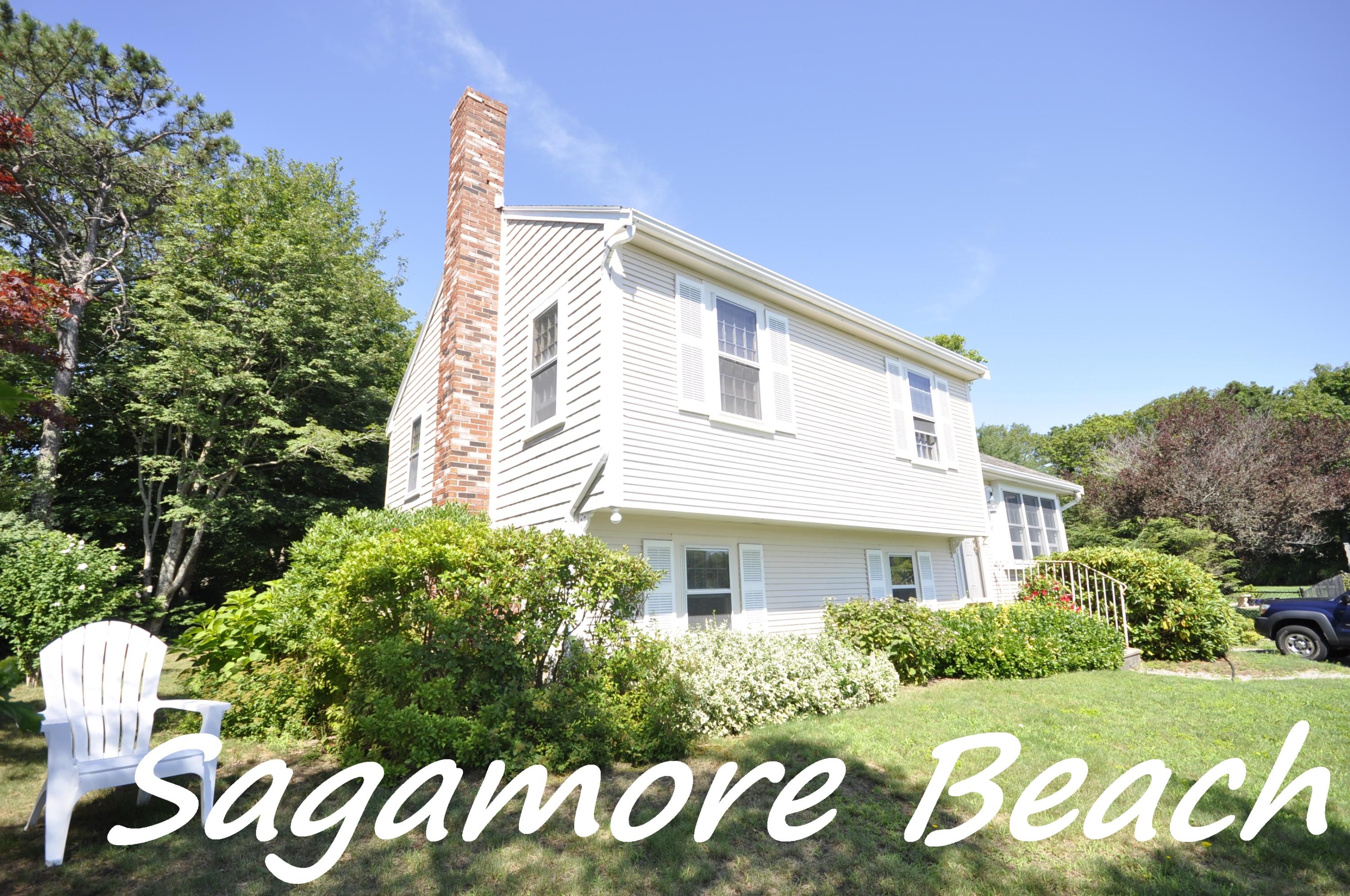 15 McGrath Road Sagamore Beach, MA 02562 - Photo 1 of 24 a front view of a house with a garden