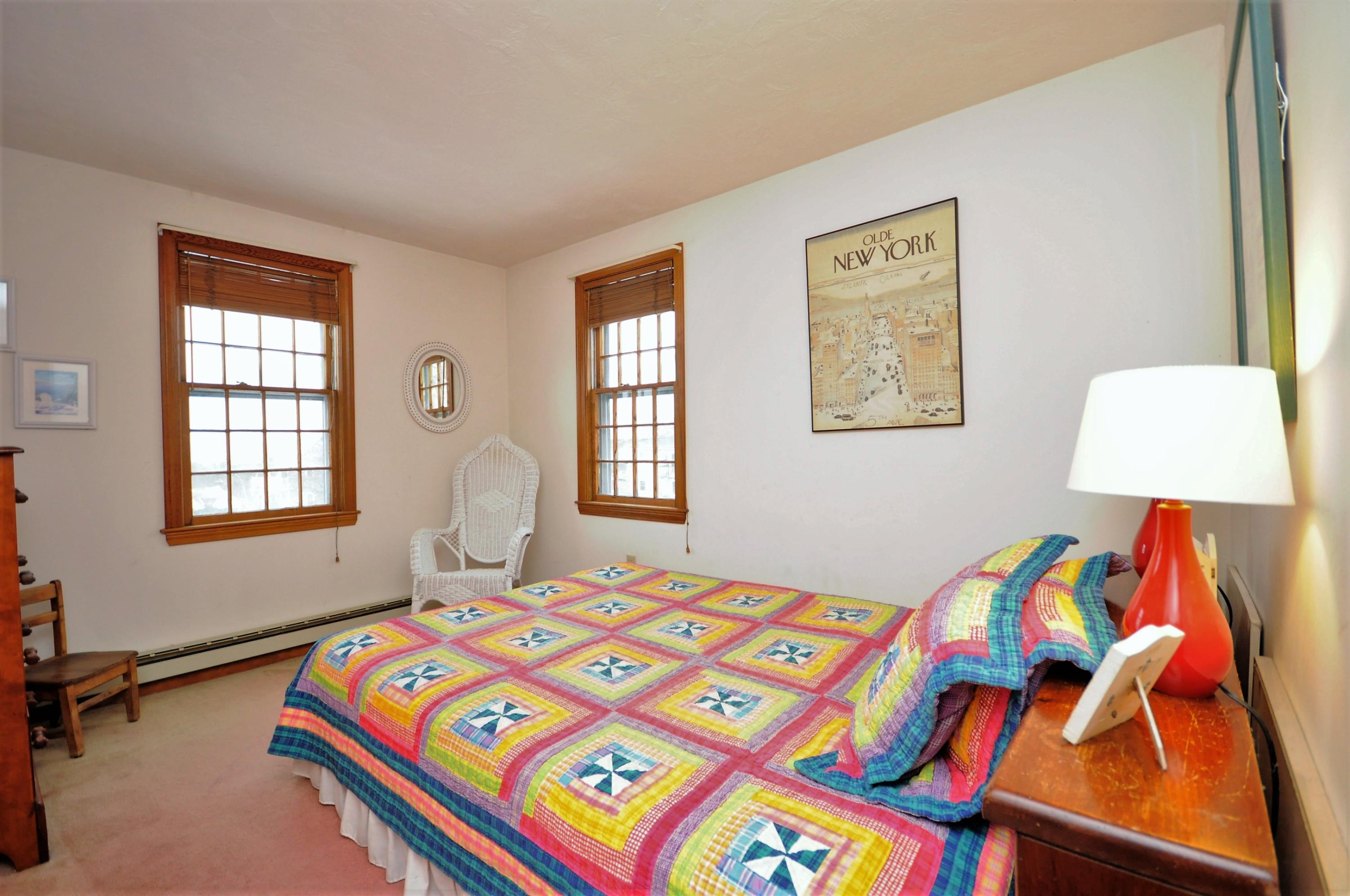 15 McGrath Road Sagamore Beach, MA 02562 - Photo 11 of 24 a bedroom with a bed and a window