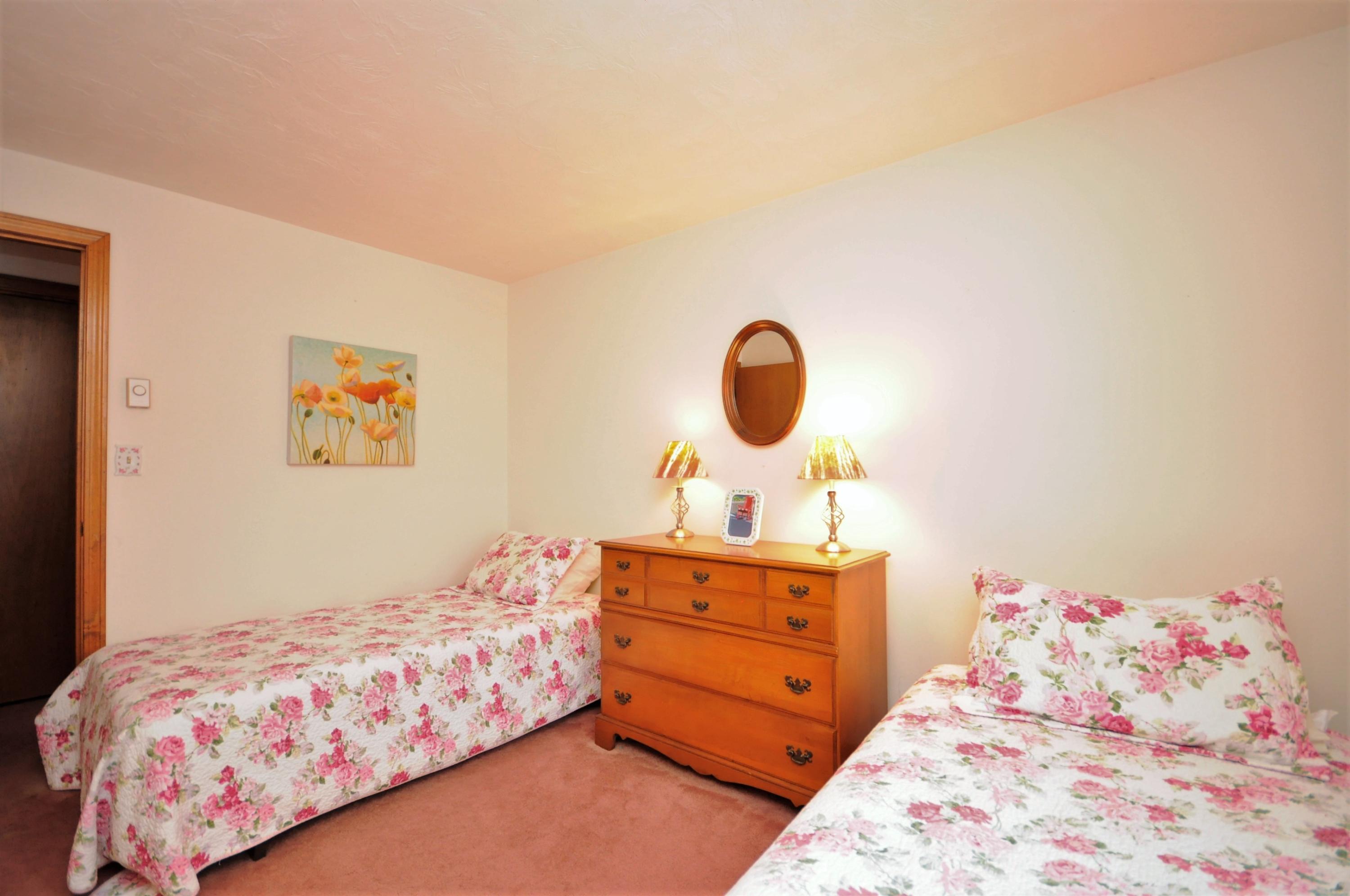 15 McGrath Road Sagamore Beach, MA 02562 - Photo 13 of 24 a bedroom with a bed and lamp
