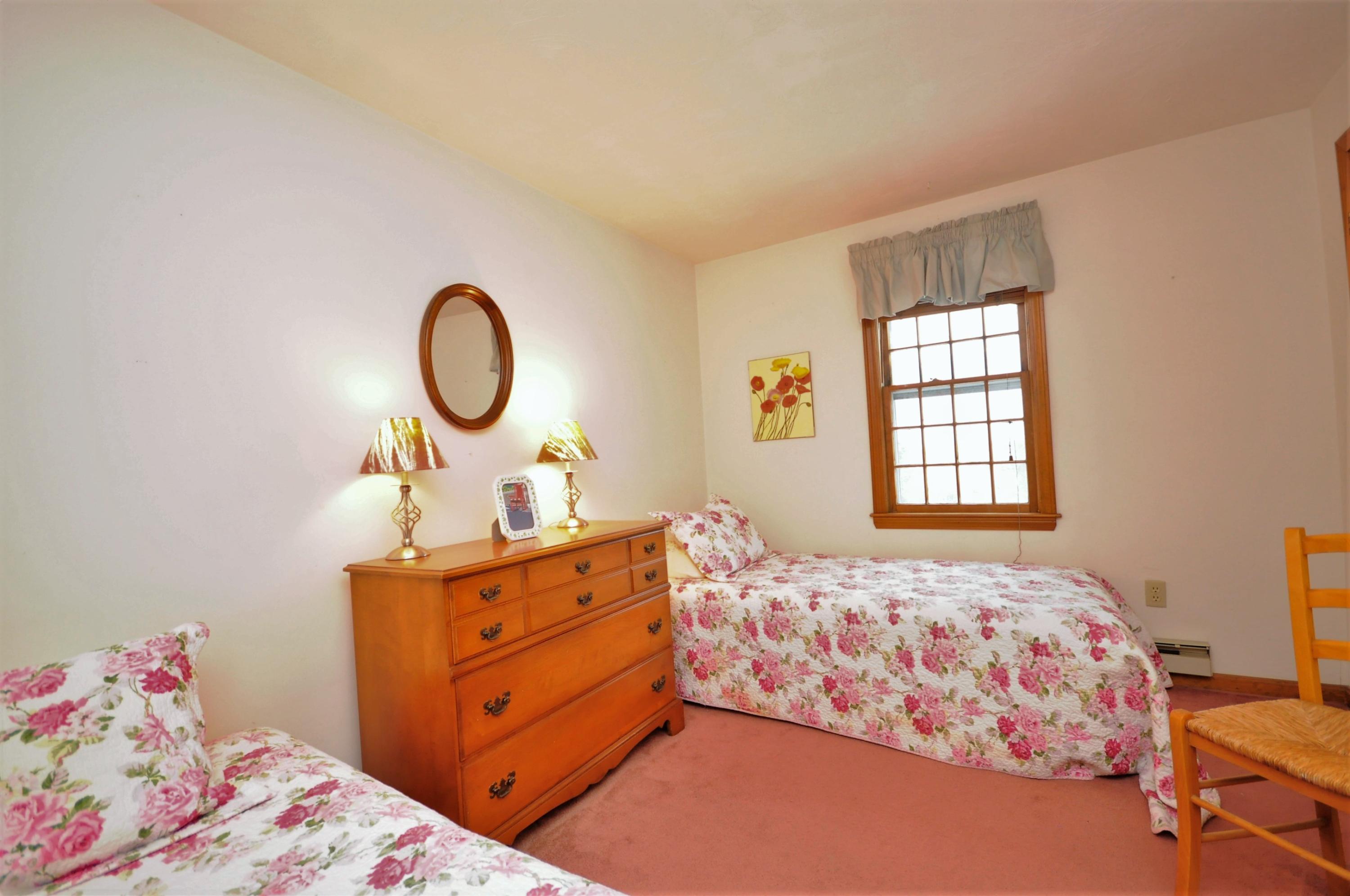 15 McGrath Road Sagamore Beach, MA 02562 - Photo 14 of 24 a bed room with a bed and a baby crib