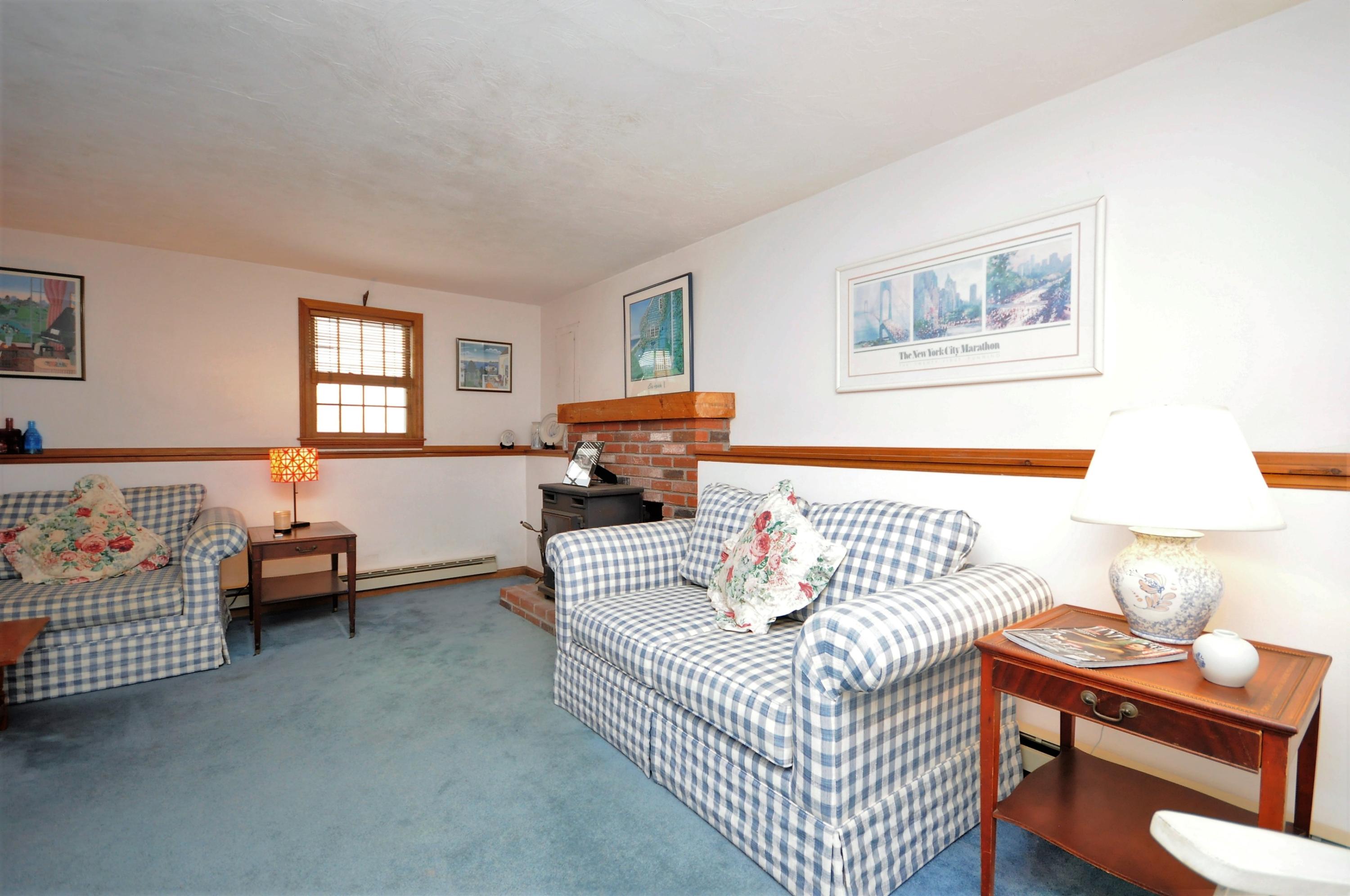 15 McGrath Road Sagamore Beach, MA 02562 - Photo 19 of 24 a living room with furniture and a wooden floor