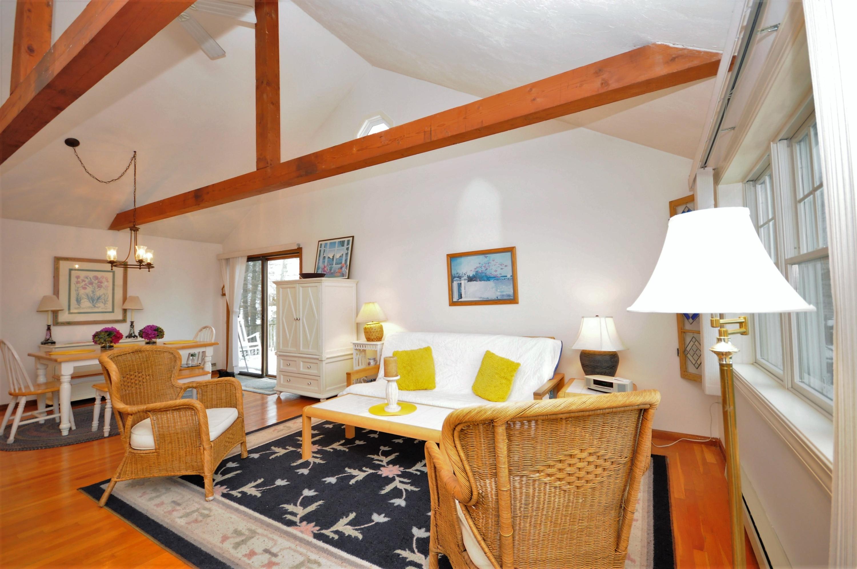 15 McGrath Road Sagamore Beach, MA 02562 - Photo 2 of 24 a living room with furniture and a table