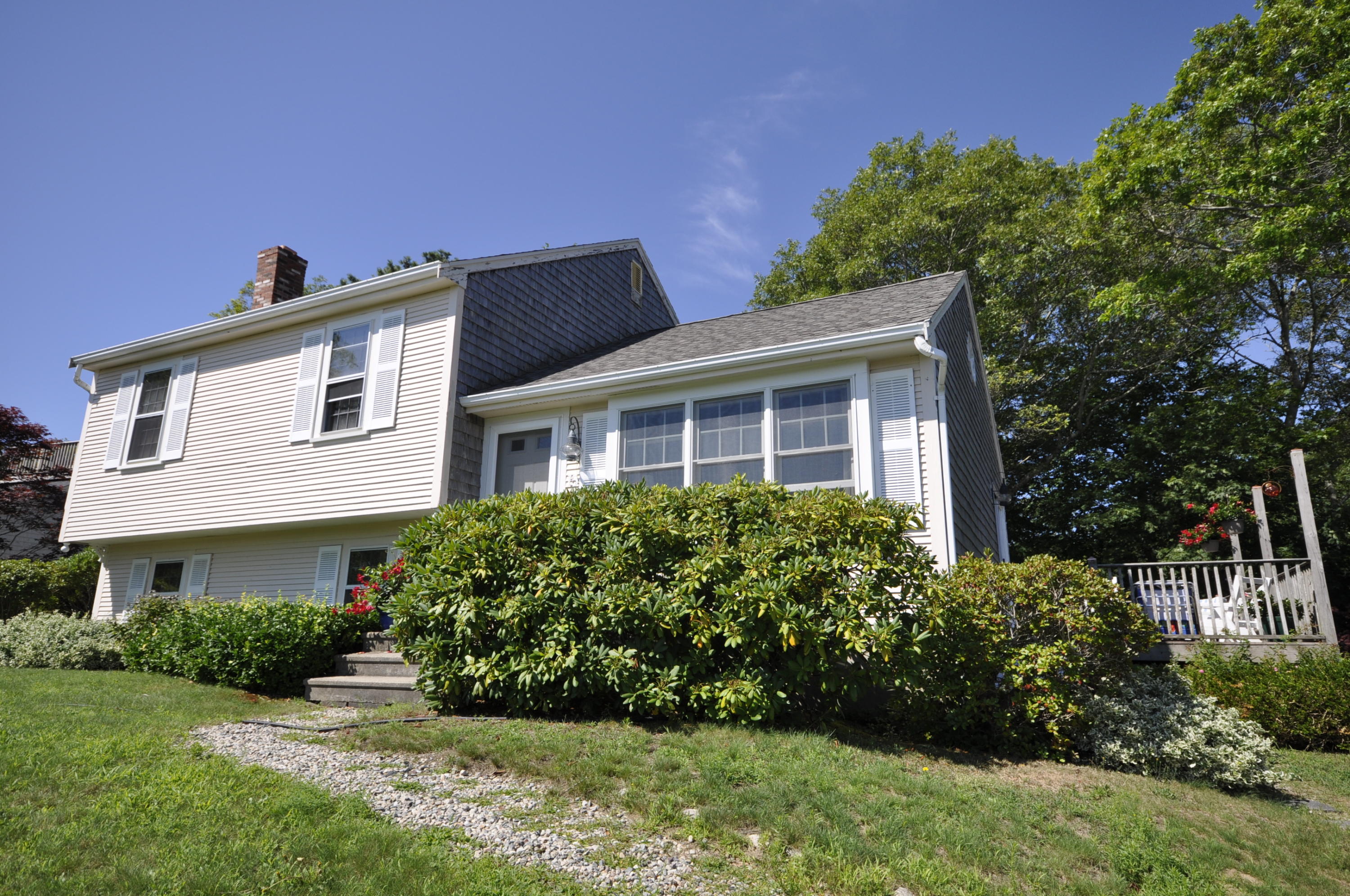 15 McGrath Road Sagamore Beach, MA 02562 - Photo 22 of 24 a front view of a house with a yard