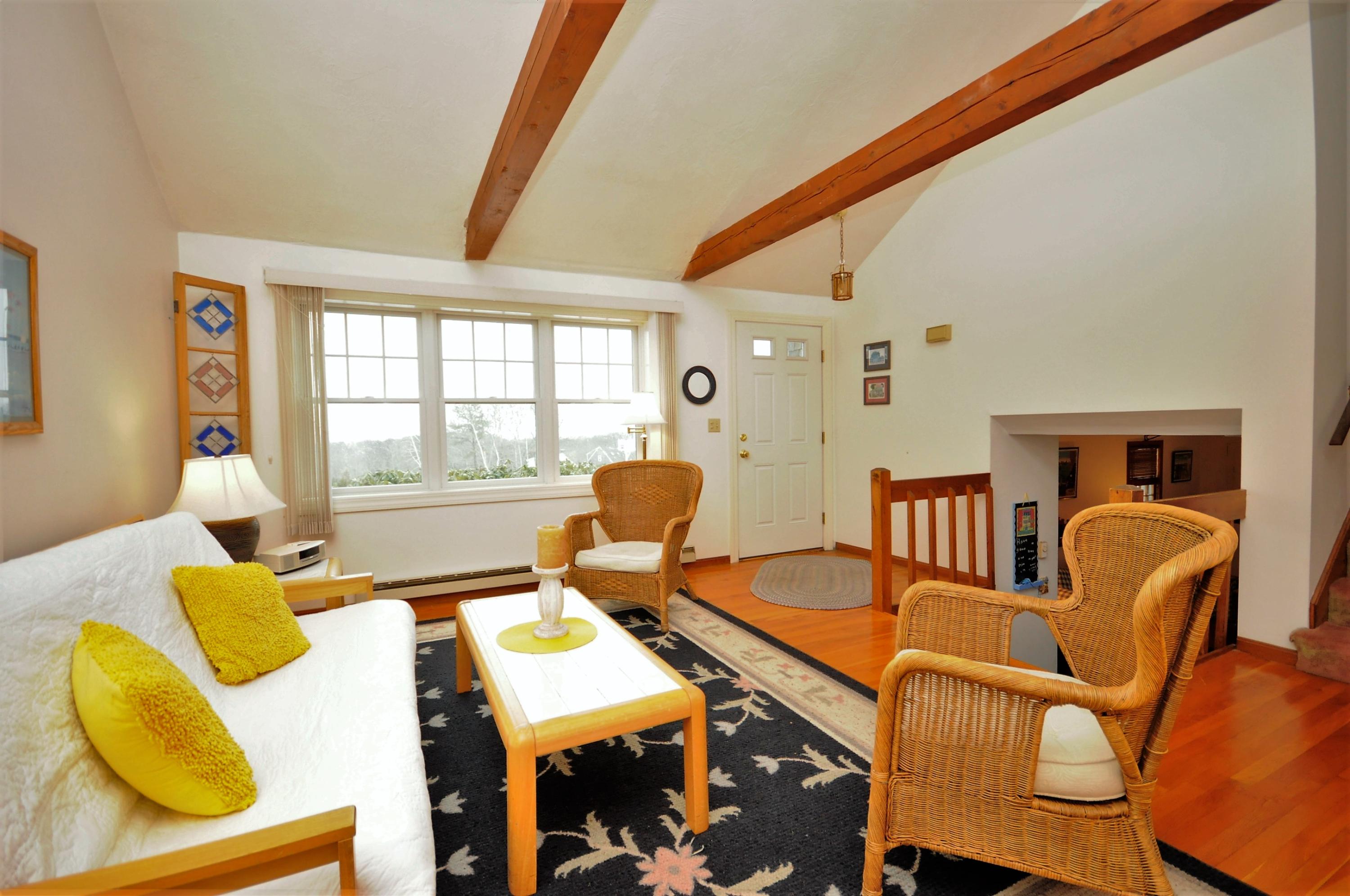 15 McGrath Road Sagamore Beach, MA 02562 - Photo 3 of 24 a bedroom with furniture and a window
