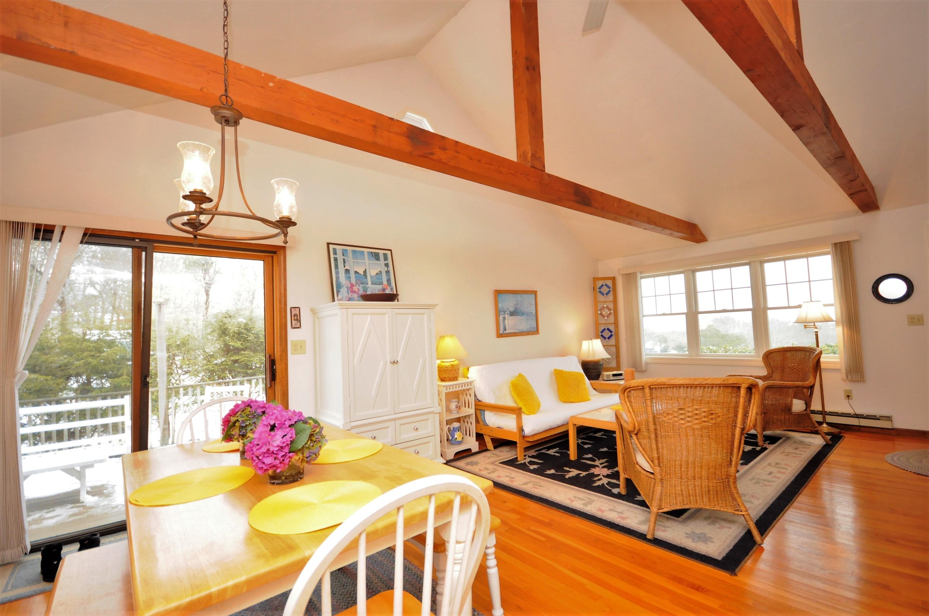 15 McGrath Road Sagamore Beach, MA 02562 - Photo 4 of 24 a living room with furniture windows and wooden floor