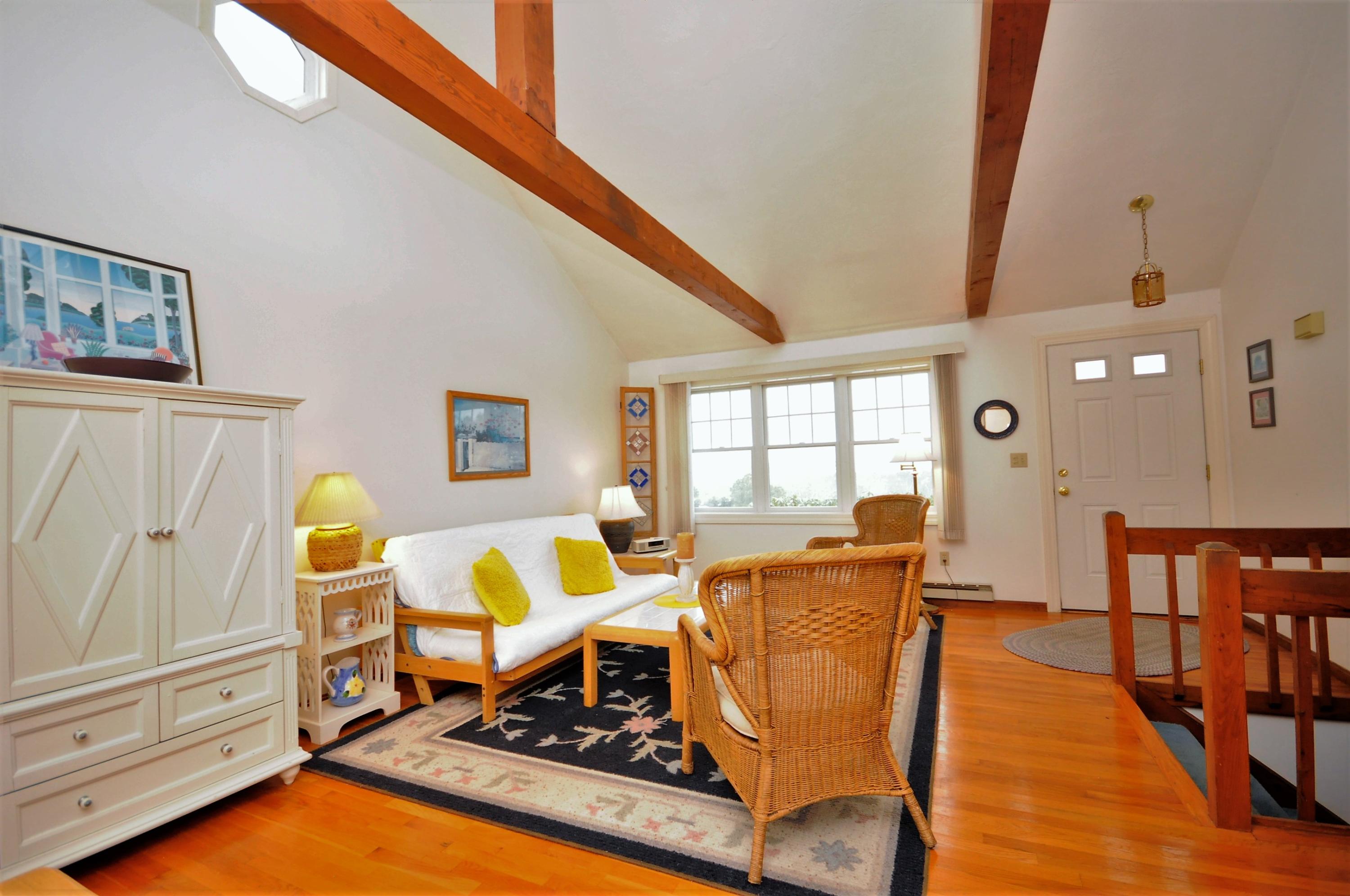 15 McGrath Road Sagamore Beach, MA 02562 - Photo 5 of 24 a living room with furniture and wooden floor
