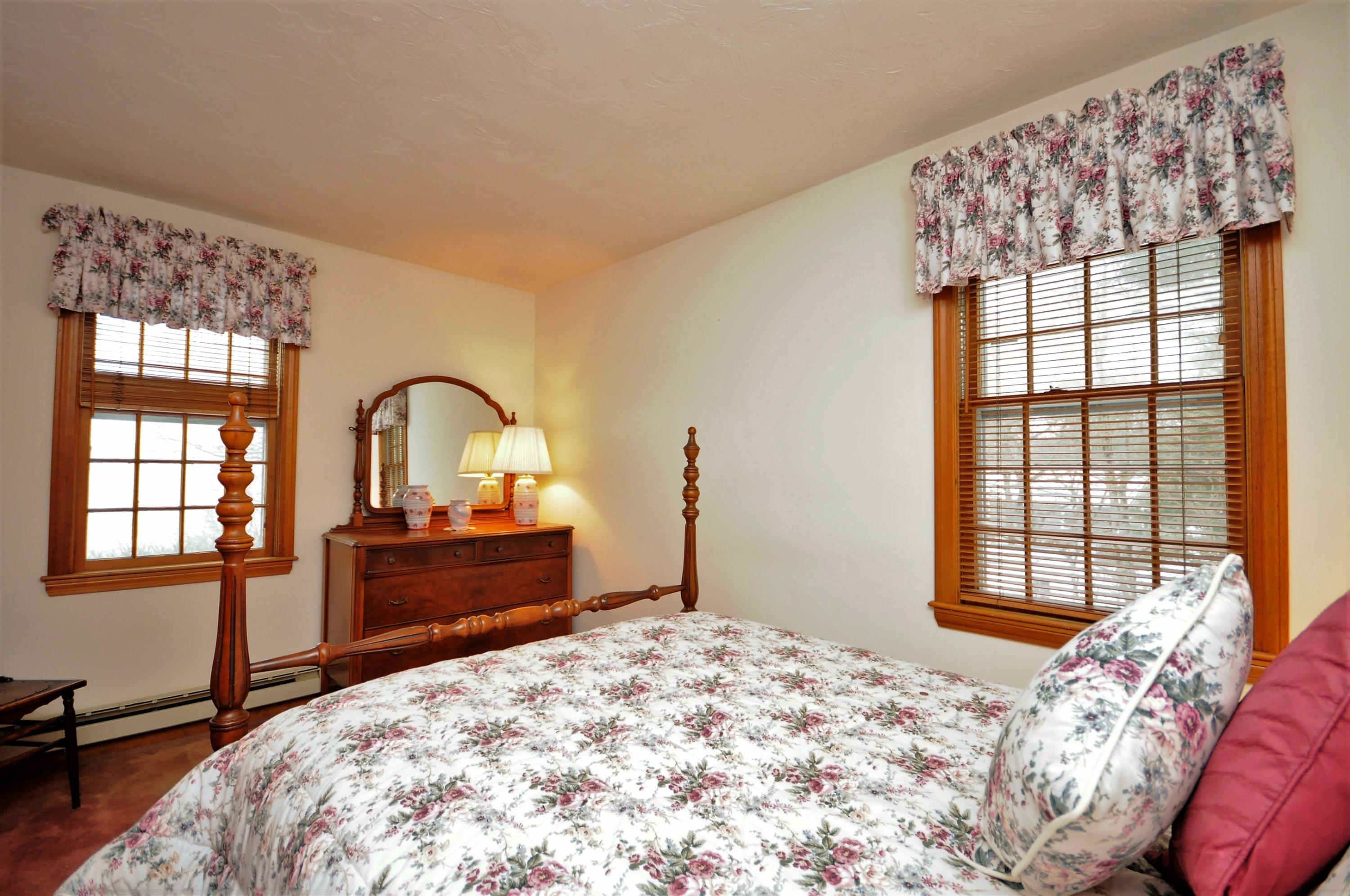 15 McGrath Road Sagamore Beach, MA 02562 - Photo 9 of 24 a bedroom with a bed and a window