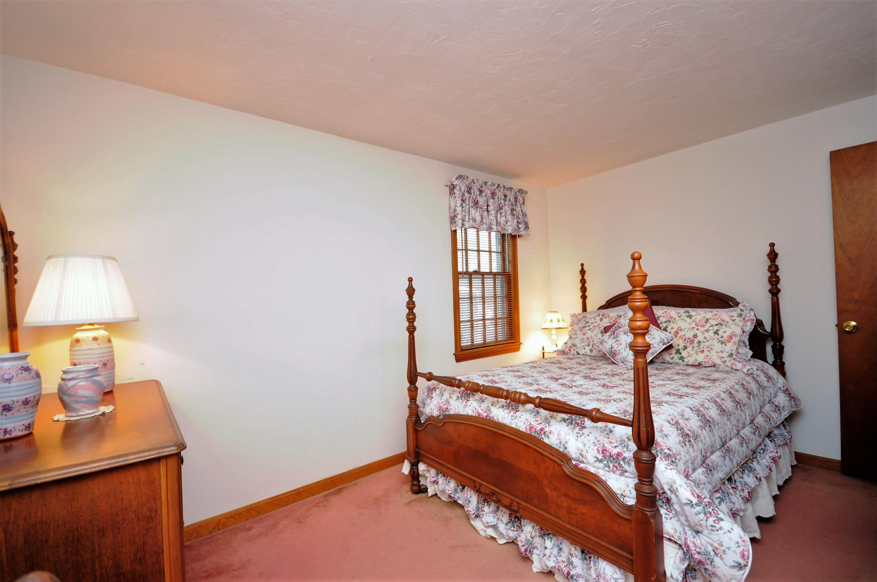 15 McGrath Road Sagamore Beach, MA 02562 - Photo 10 of 24 a bedroom with a bed and a window
