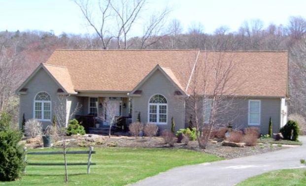 789 Flanders Road Southington, CT 06489 - Photo 1 of 1 a front view of a house with garden and porch