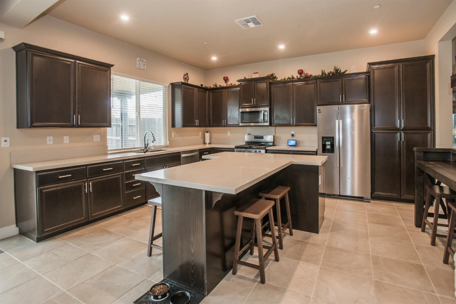 1082 Marichal Way Galt, CA 95632 - Photo 13 of 45 a kitchen with a sink stainless steel appliances and cabinets