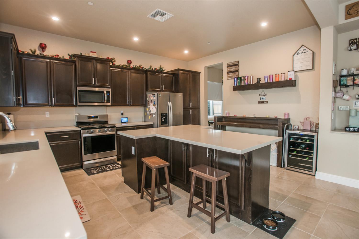 1082 Marichal Way Galt, CA 95632 - Photo 15 of 45 a kitchen with stainless steel appliances kitchen island granite countertop a sink and cabinets