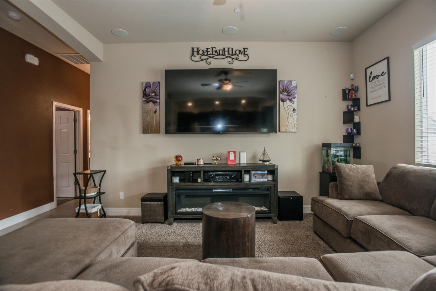 1082 Marichal Way Galt, CA 95632 - Photo 20 of 45 a living room with furniture and a flat screen tv