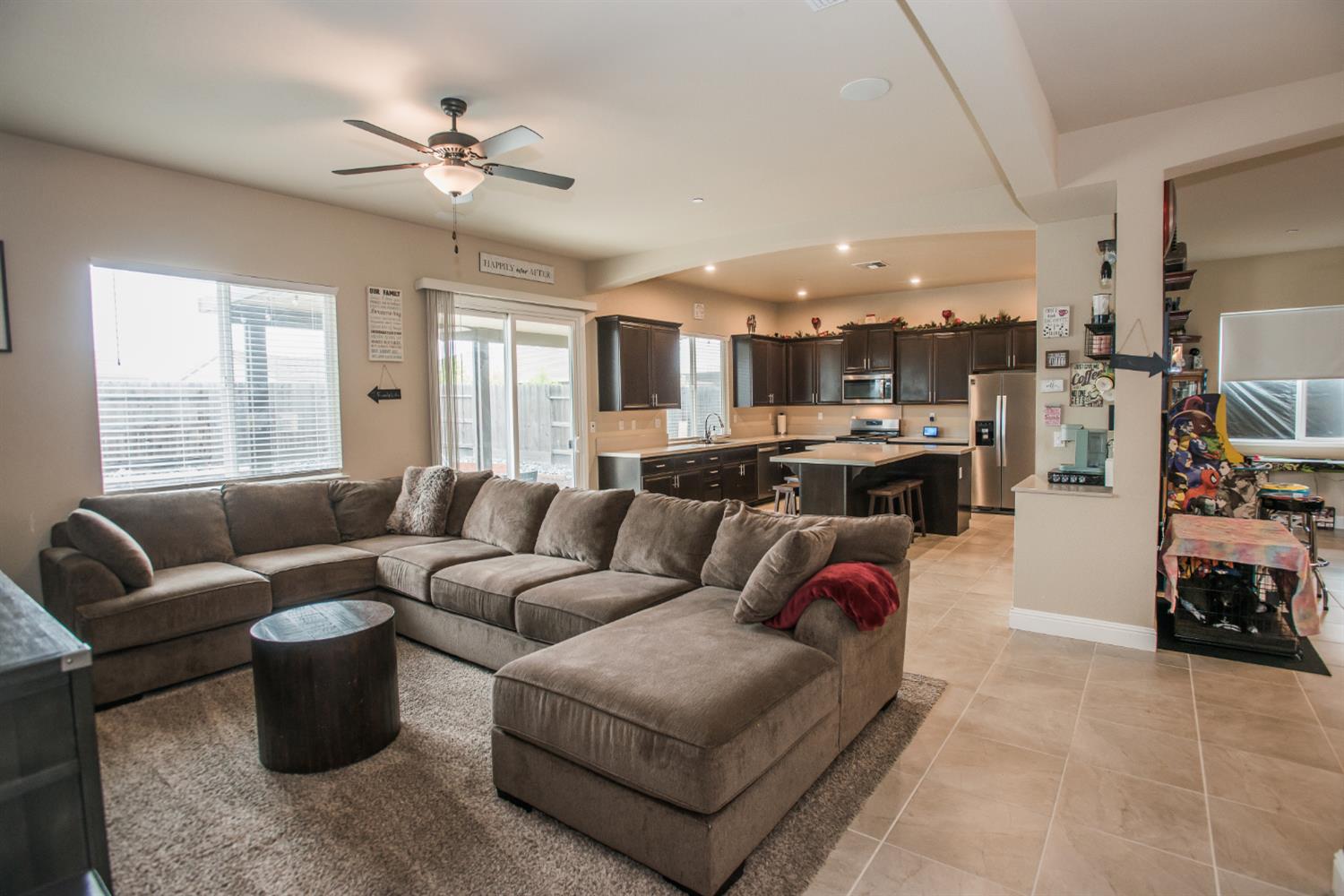 1082 Marichal Way Galt, CA 95632 - Photo 21 of 45 a living room with furniture kitchen view and a large window