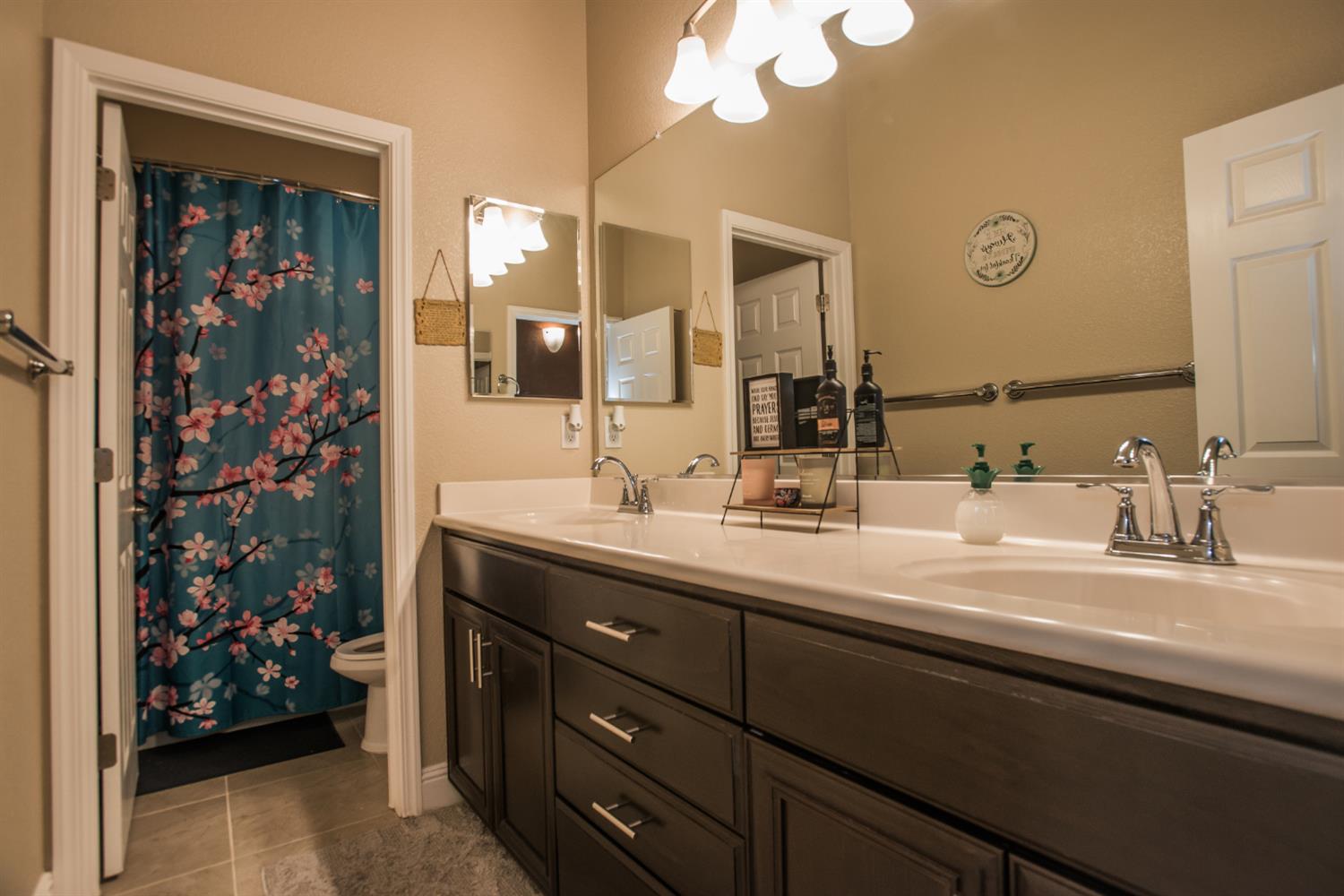 1082 Marichal Way Galt, CA 95632 - Photo 23 of 45 a bathroom with a sink vanity and a mirror