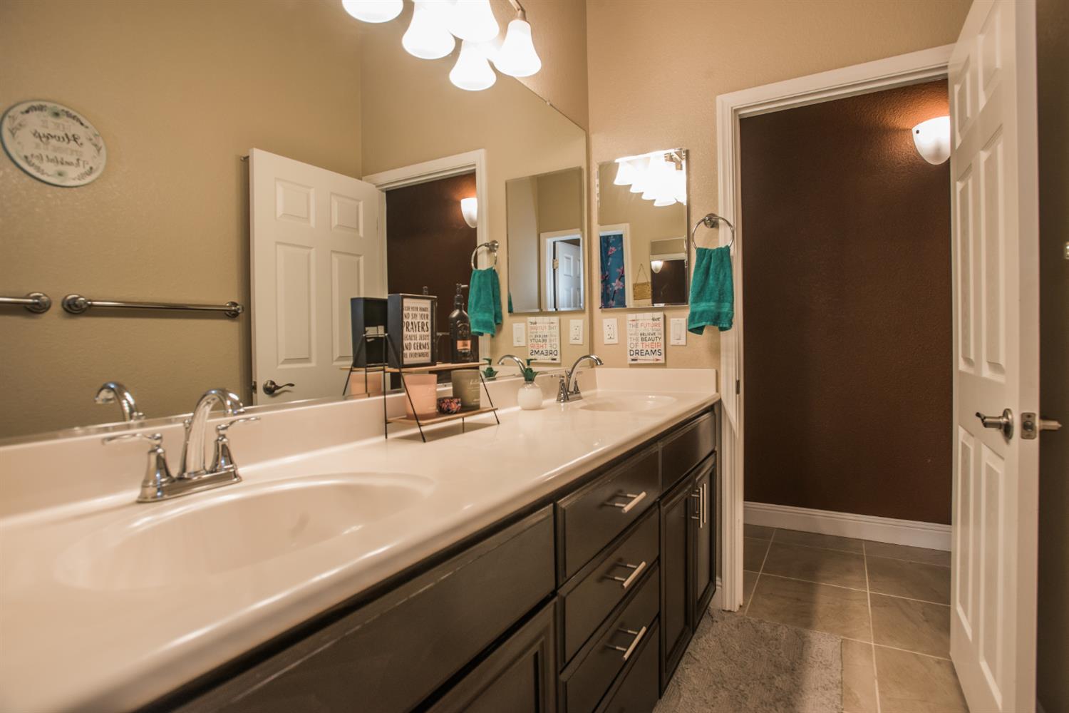 1082 Marichal Way Galt, CA 95632 - Photo 25 of 45 a bathroom with a sink and a mirror