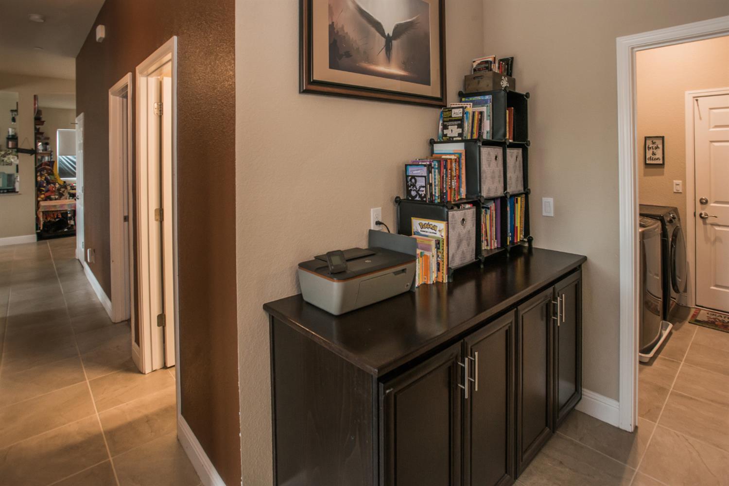 1082 Marichal Way Galt, CA 95632 - Photo 29 of 45 a kitchen with kitchen island a counter top space and a refrigerator