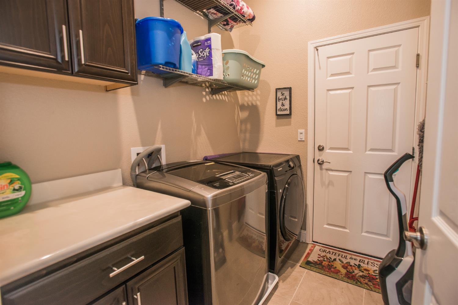 1082 Marichal Way Galt, CA 95632 - Photo 32 of 45 a utility room with dryer and washer