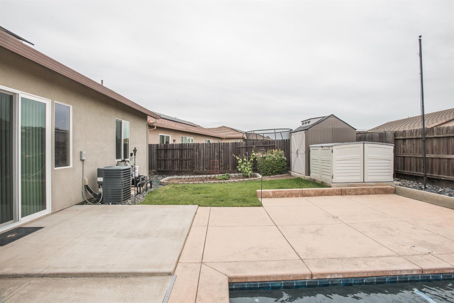 1082 Marichal Way Galt, CA 95632 - Photo 40 of 45 a view of backyard of house and car parked