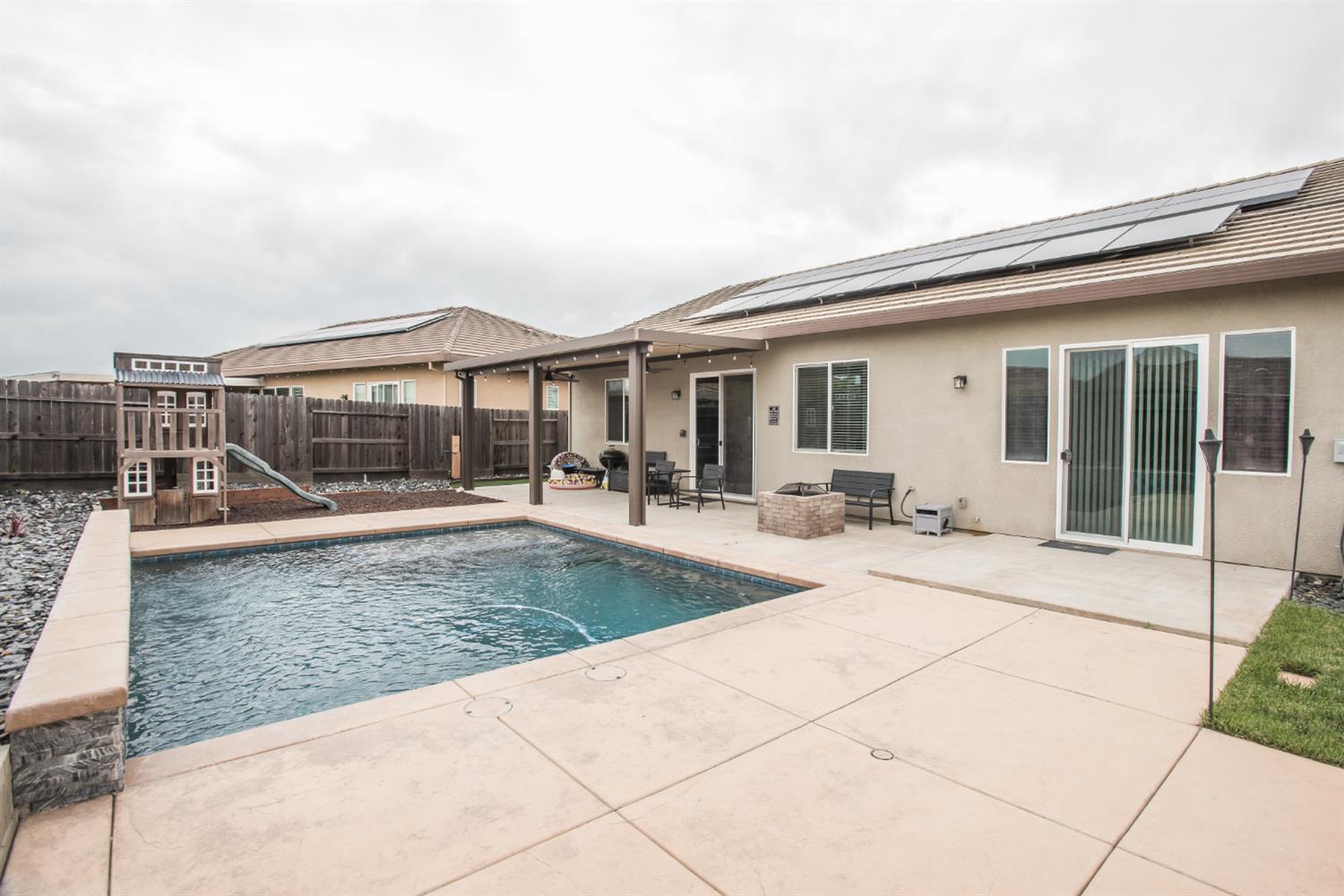 1082 Marichal Way Galt, CA 95632 - Photo 42 of 45 a view of a house with backyard porch and sitting area