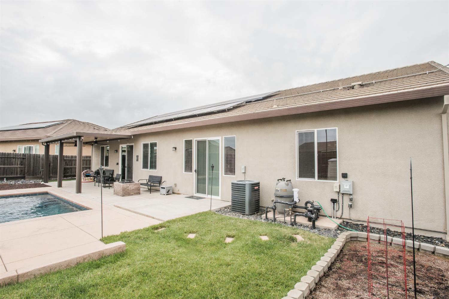 1082 Marichal Way Galt, CA 95632 - Photo 45 of 45 a patio with table and chairs and potted plants