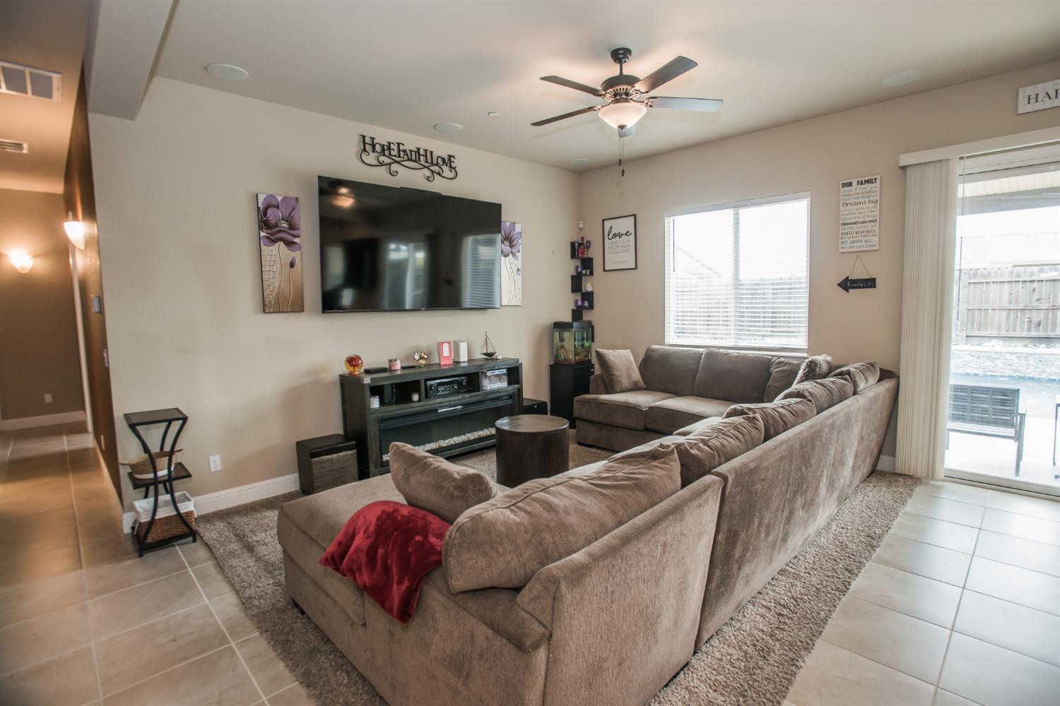 1082 Marichal Way Galt, CA 95632 - Photo 10 of 45 a living room with furniture and a flat screen tv
