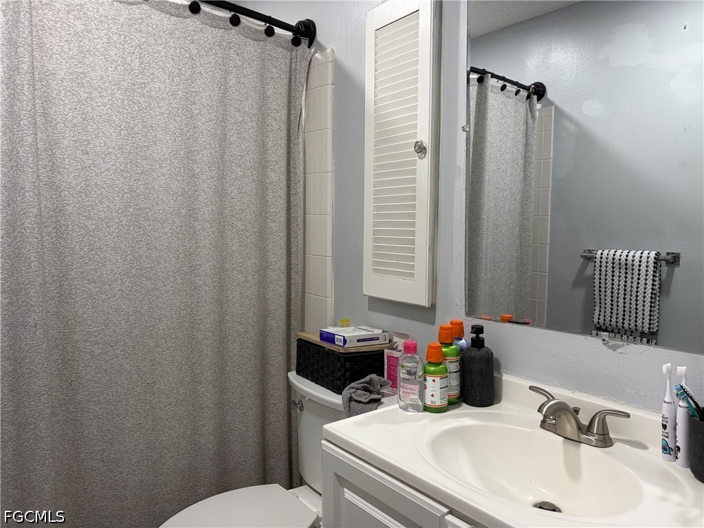 2175 Twin Brooks Road North Fort Myers, FL 33917 - Photo 24 of 27 a bathroom with a sink toilet and shower