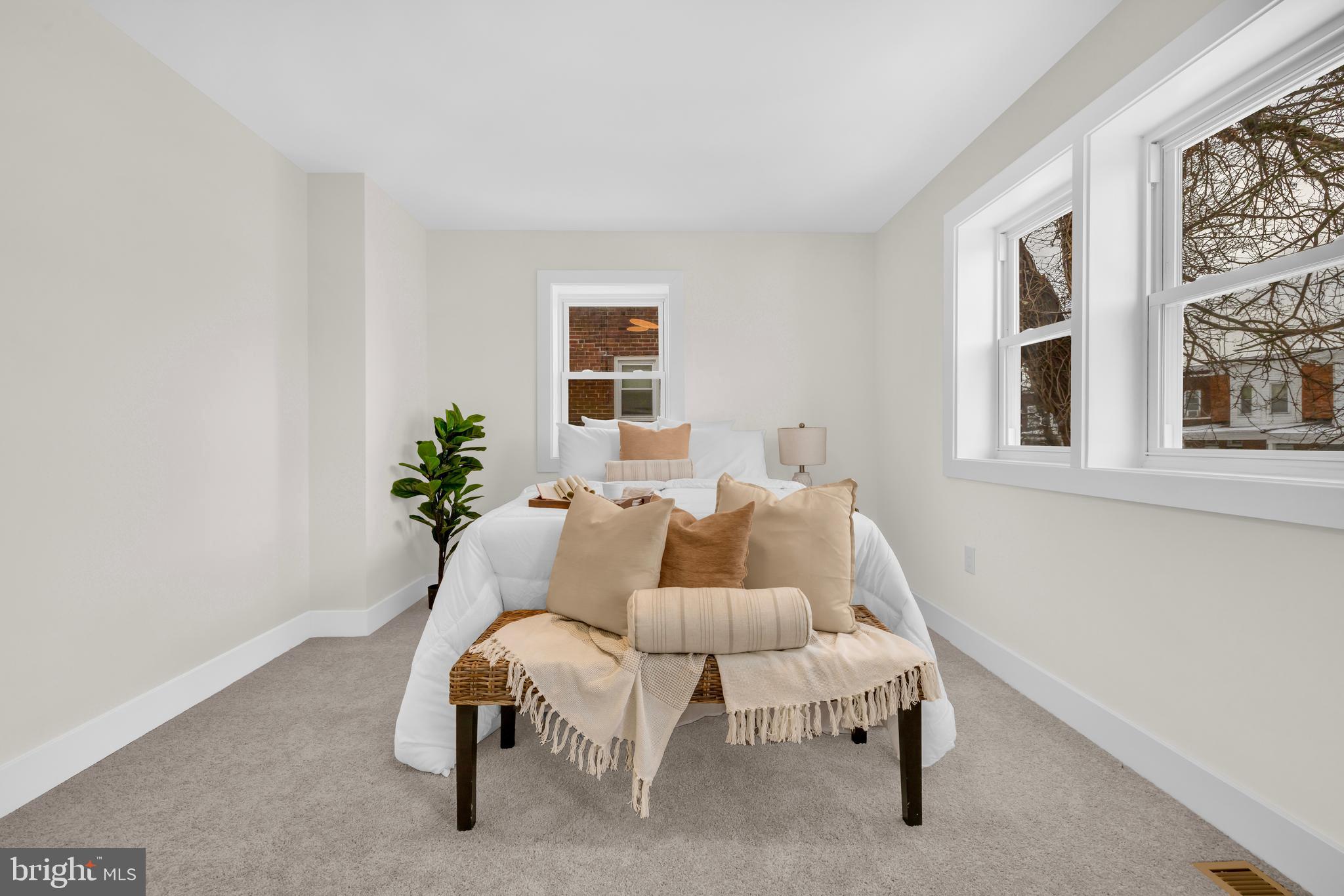 3827 Cottage Avenue Baltimore, MD 21215 - Photo 11 of 43 a living room with furniture and a potted plant