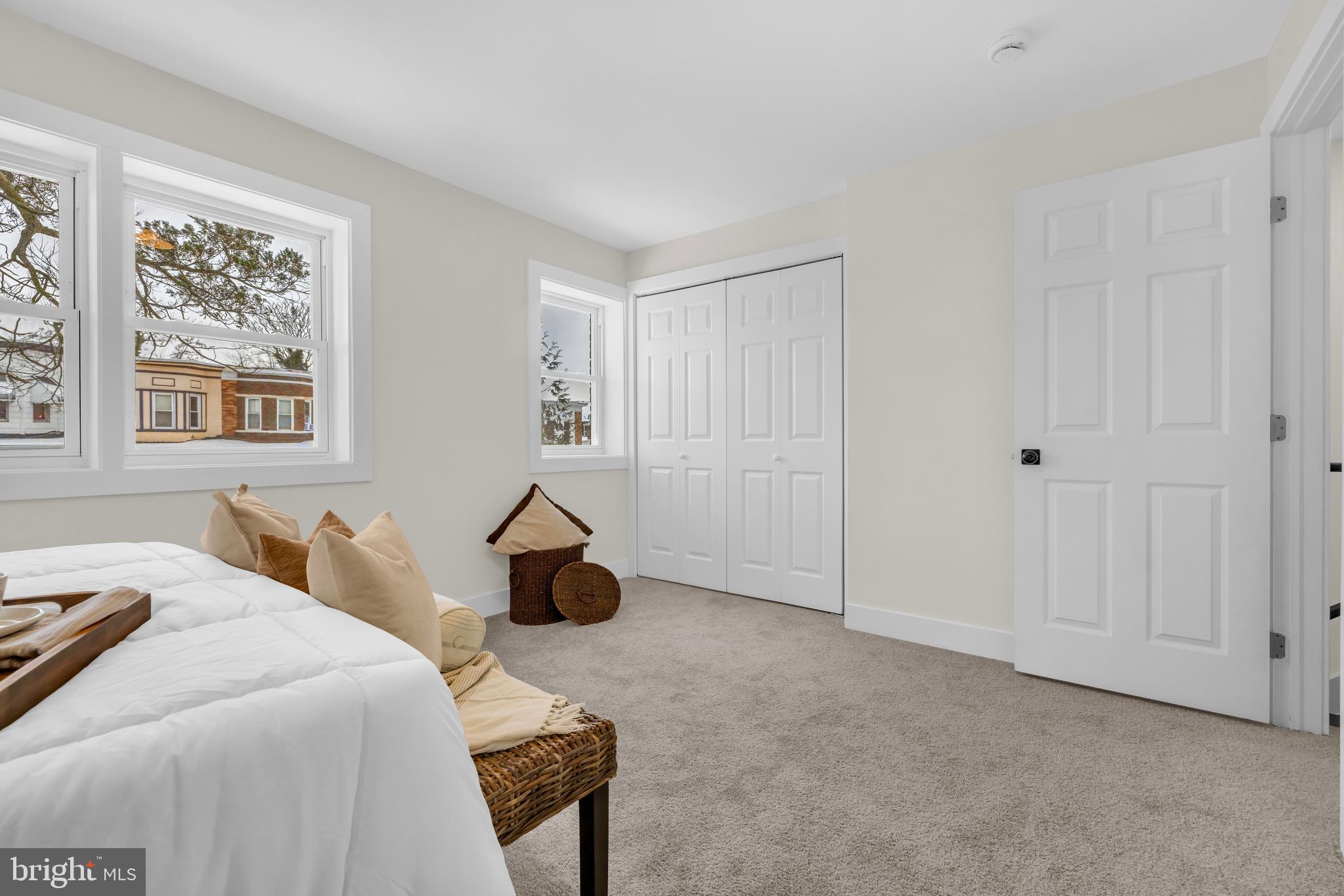 3827 Cottage Avenue Baltimore, MD 21215 - Photo 12 of 43 a bedroom with a bed and a cabinets