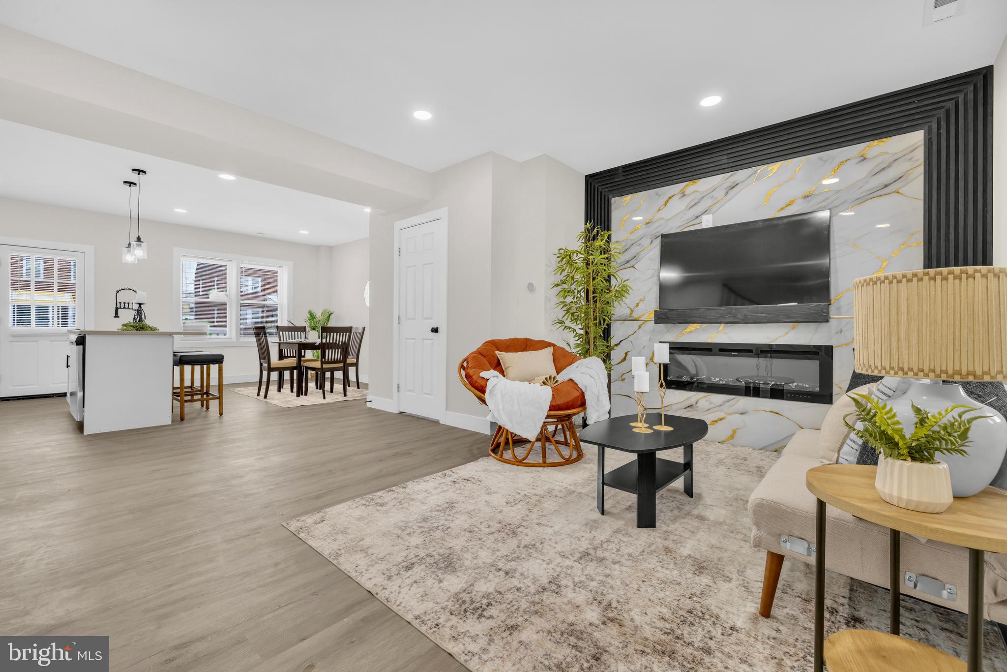 3827 Cottage Avenue Baltimore, MD 21215 - Photo 2 of 43 a living room with furniture and a flat screen tv