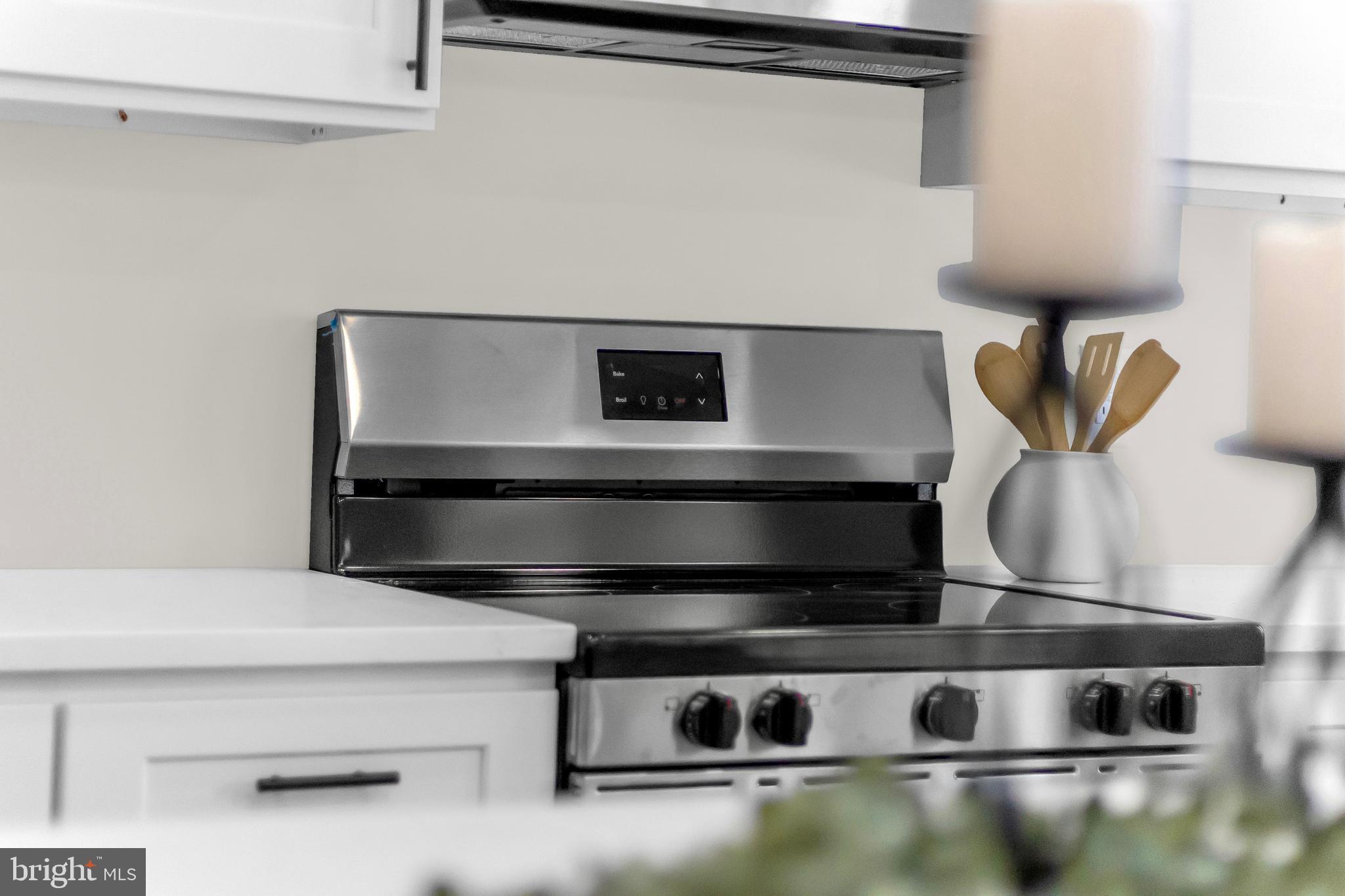 3827 Cottage Avenue Baltimore, MD 21215 - Photo 29 of 43 a stove top oven sitting inside of a kitchen