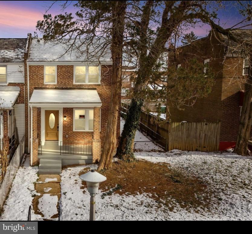 3827 Cottage Avenue Baltimore, MD 21215 - Photo 33 of 43 a view of a brick house with a large tree