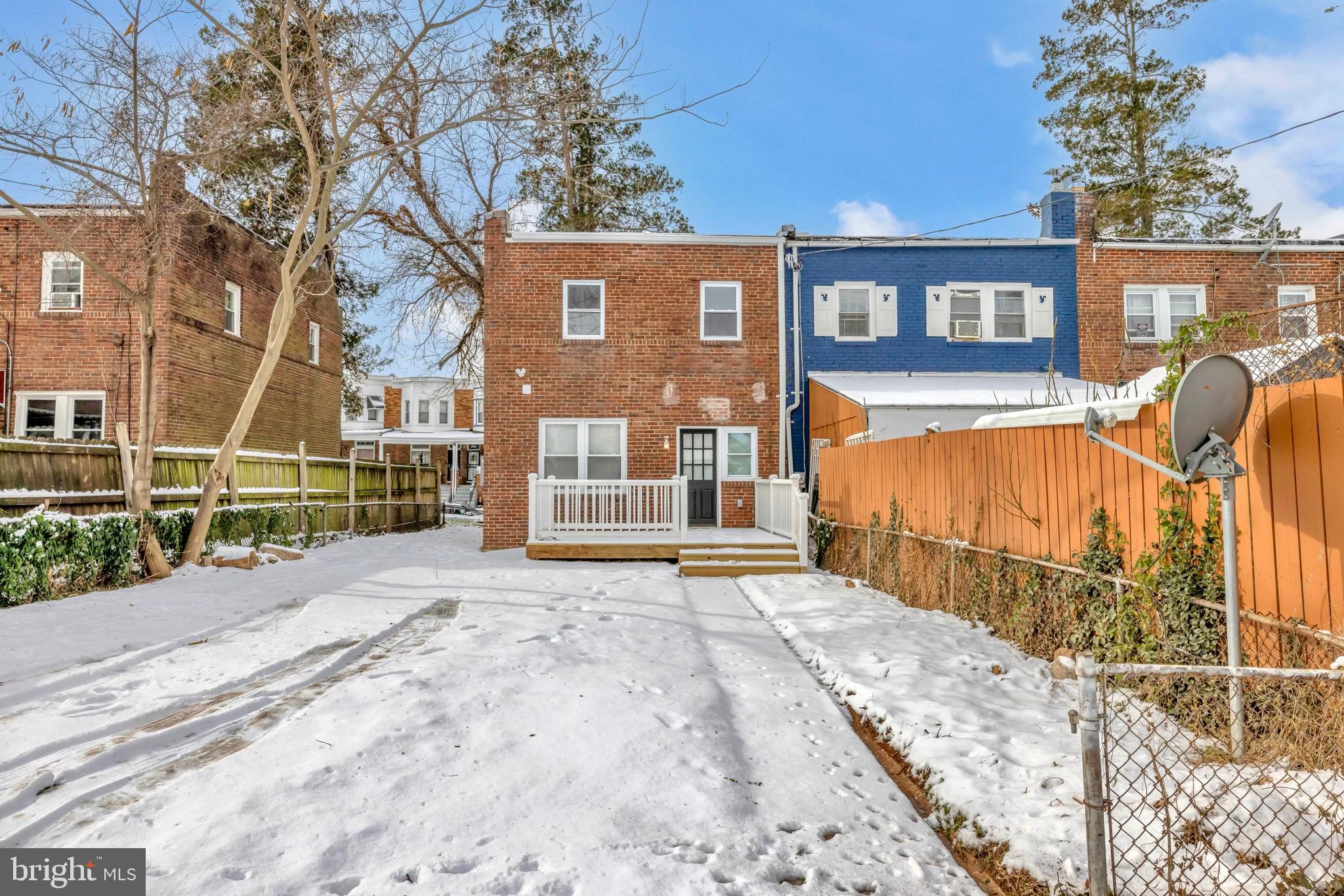 3827 Cottage Avenue Baltimore, MD 21215 - Photo 36 of 43 a view of a house with a wooden fence