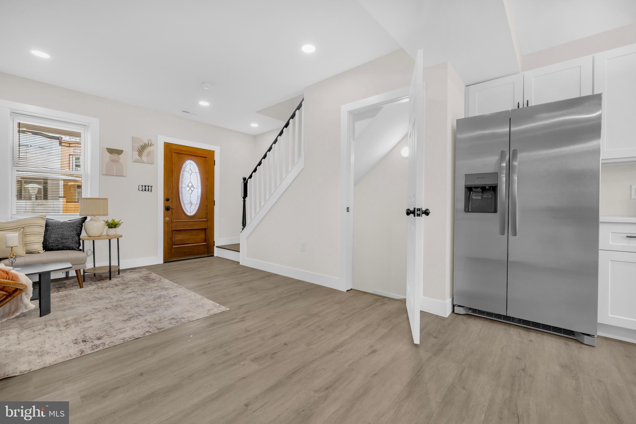 3827 Cottage Avenue Baltimore, MD 21215 - Photo 8 of 43 an empty room with wooden floor and a window