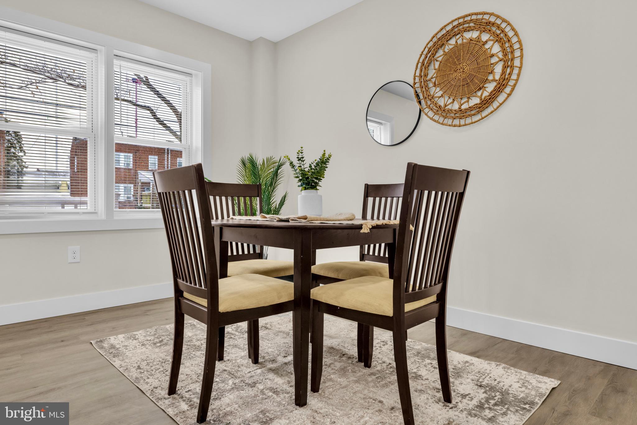3827 Cottage Avenue Baltimore, MD 21215 - Photo 9 of 43 a view of a dining room with furniture and a window