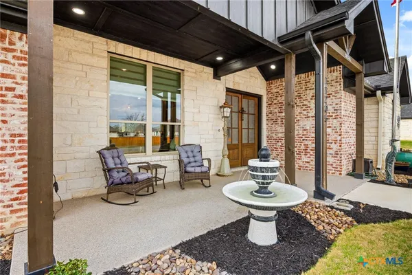 a outdoor space with patio furniture and a potted plant