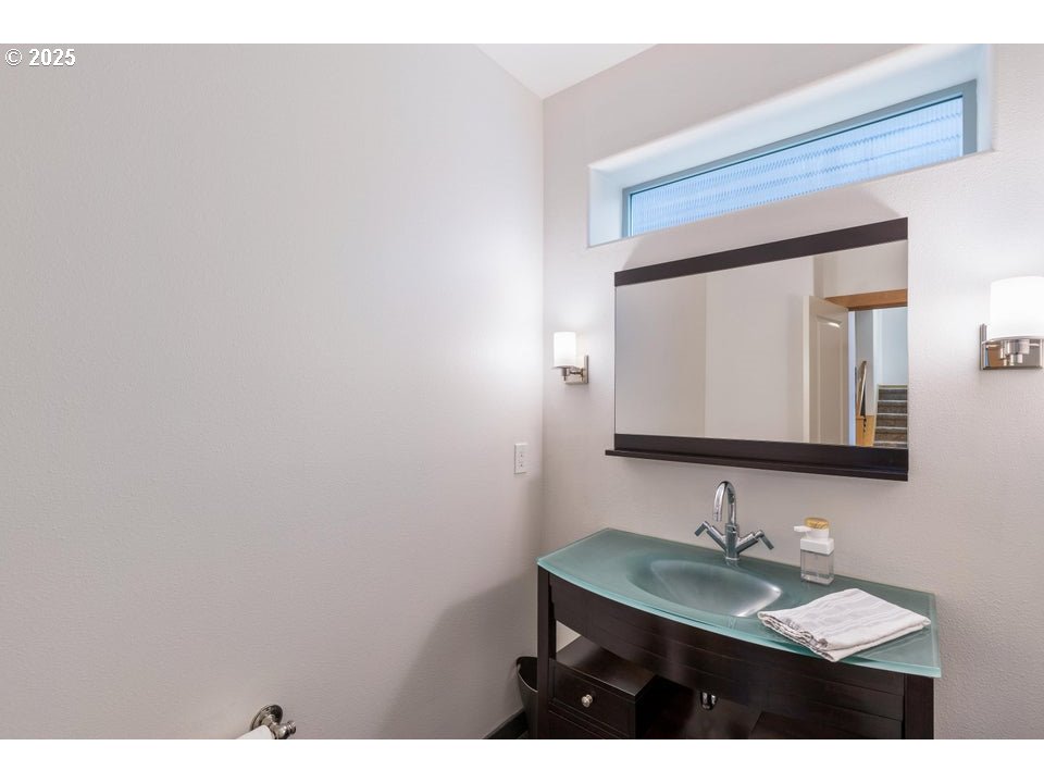 109 Southwest Taft Avenue Bend, OR 97702 - Photo 19 of 23 a bathroom with a sink and a mirror