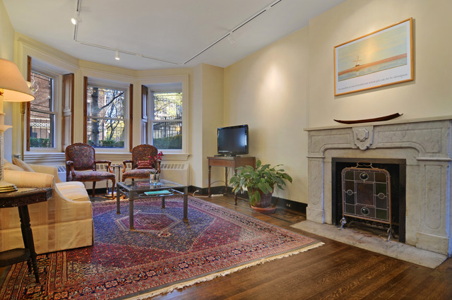 Undisclosed Address Chicago, IL 60610 - Photo 3 of 18 a living room with furniture a window and a fireplace