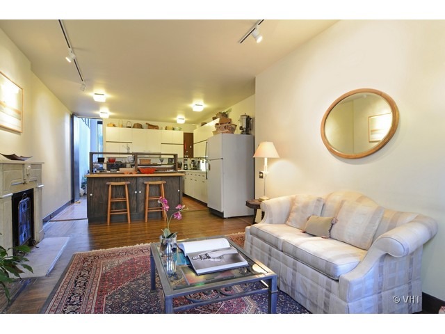 Undisclosed Address Chicago, IL 60610 - Photo 5 of 18 a living room with furniture and kitchen view