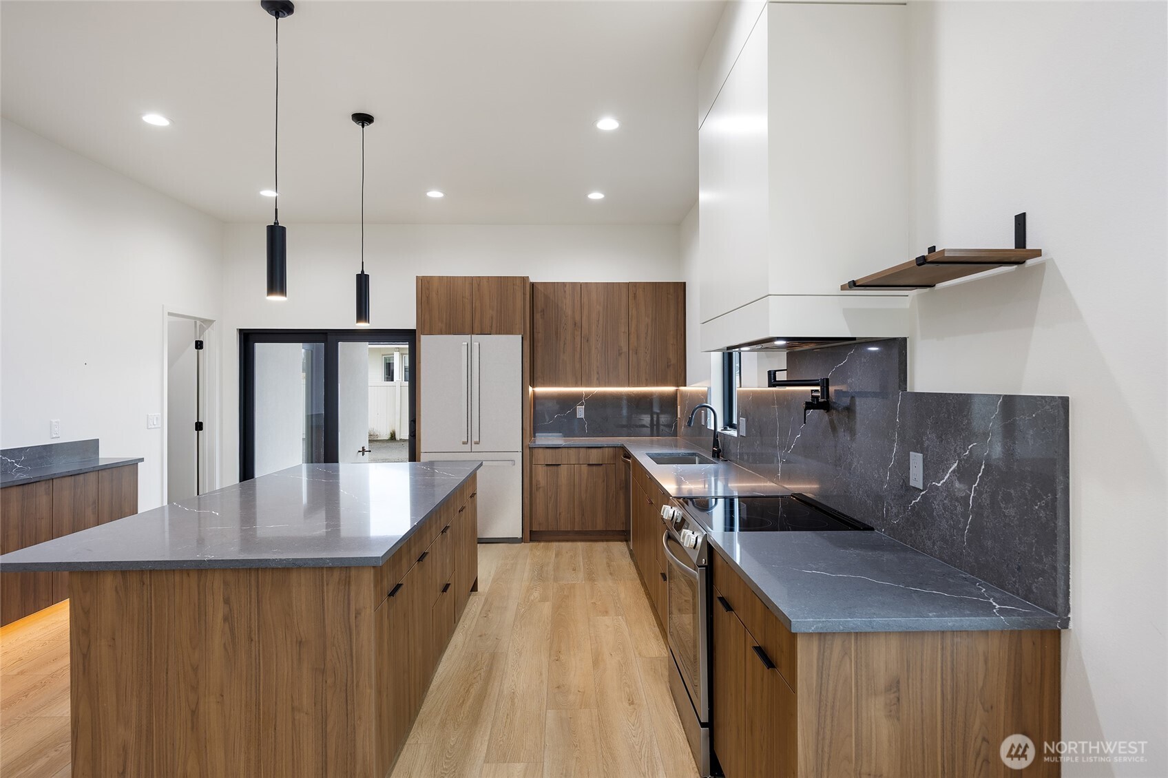 501 Sand Dune Road Moses Lake, WA 98837 - Photo 12 of 38 a kitchen with counter top space a sink and appliances