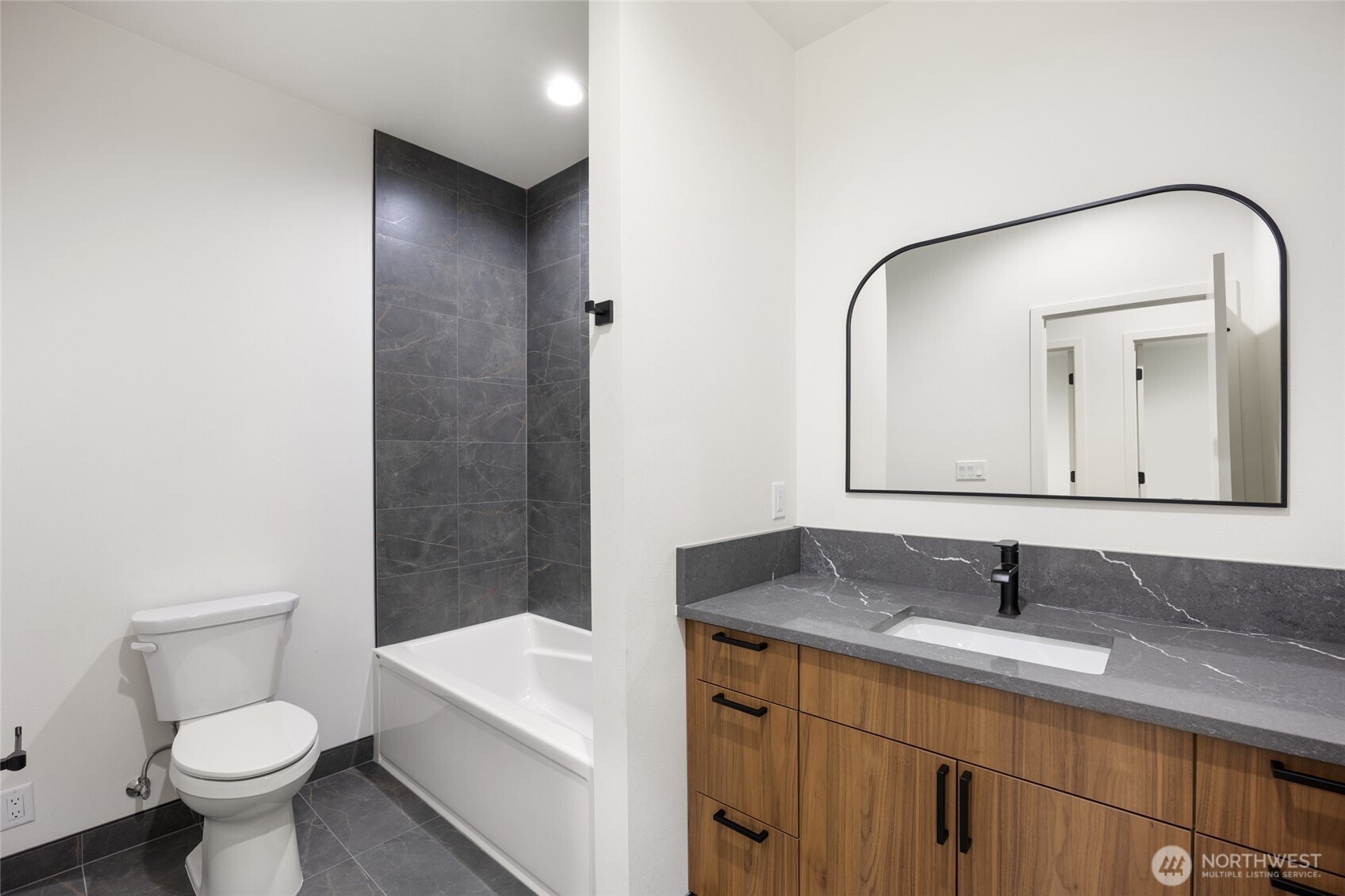 501 Sand Dune Road Moses Lake, WA 98837 - Photo 23 of 38 a bathroom with a toilet sink a mirror and vanity